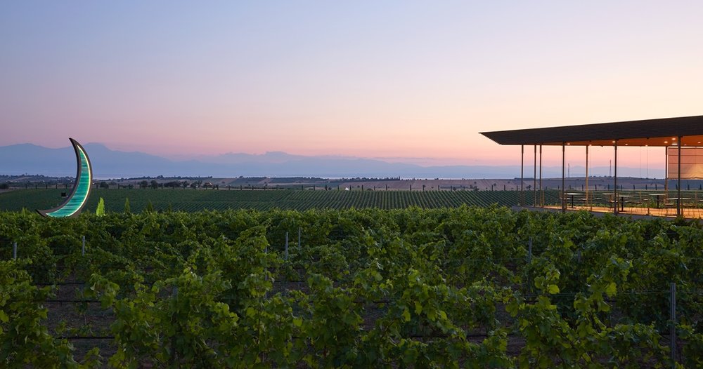  The patio at the winetasting room, Ktima Gerovassiliou. In the background is the bay of Thessaloniki and mountain ranges near Mount Olympus. 